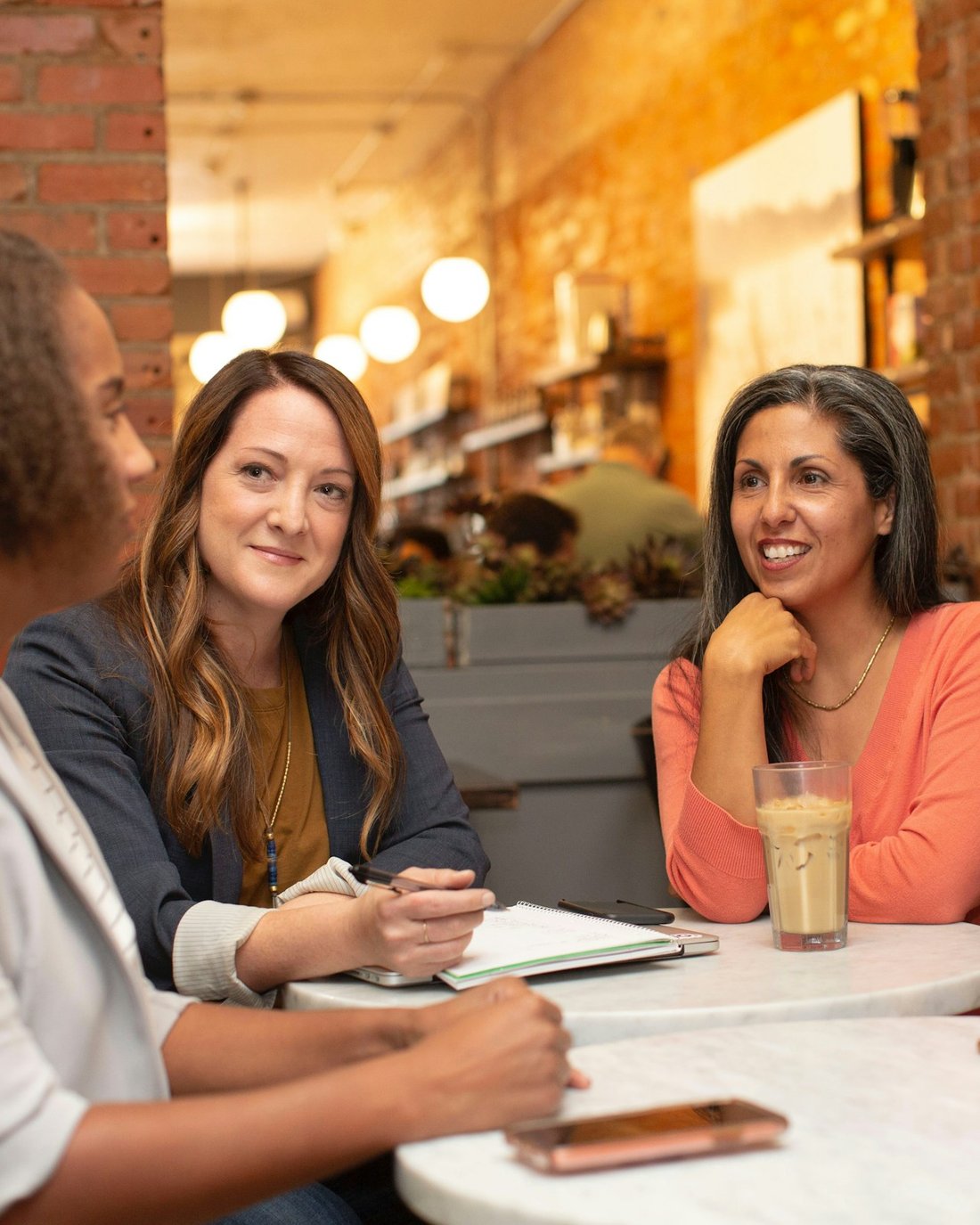 A small circle of women in conversation